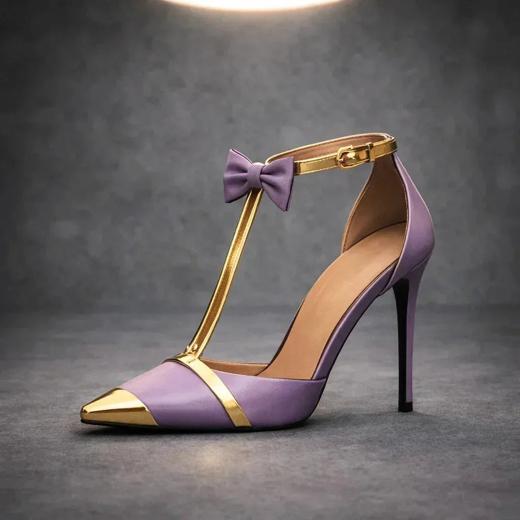 Classic white women's dress heels: pointed-toe T-strap stilettos with a refined bow detail.