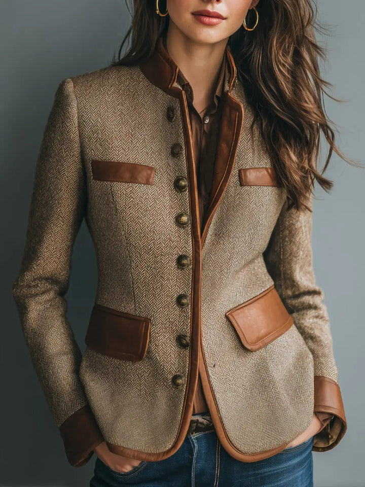 Women's quilted herringbone jacket with distinctive trim, perfect for elegant autumn style or smart office wear.