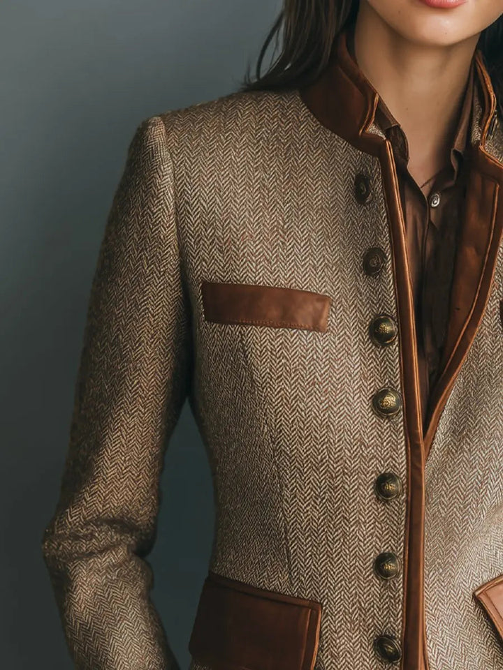 Vintage-inspired women's quilted herringbone jacket, tailored with unique trim. Ideal for sophisticated smart casual outfits.