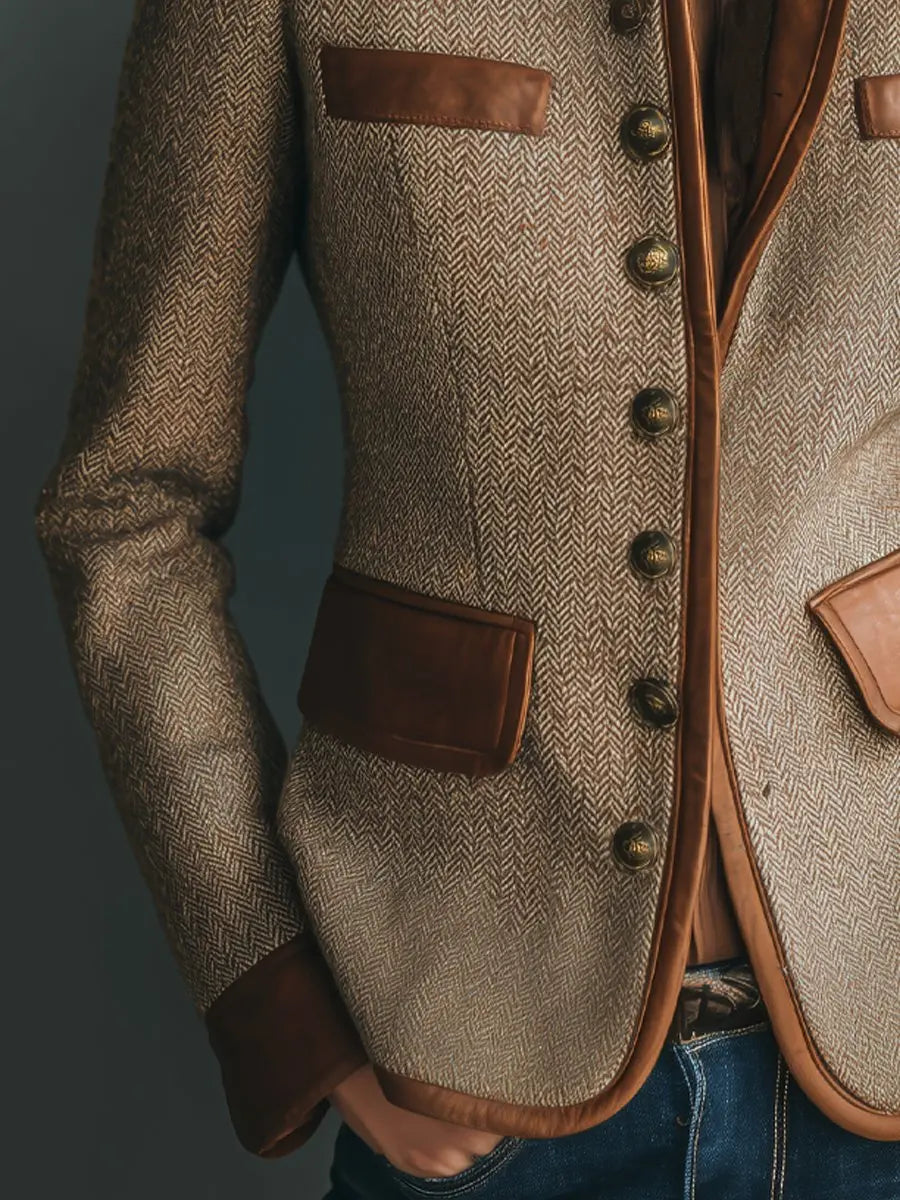 Chic women's quilted herringbone jacket featuring a distinctive trim, offering a smart casual or office-ready look.