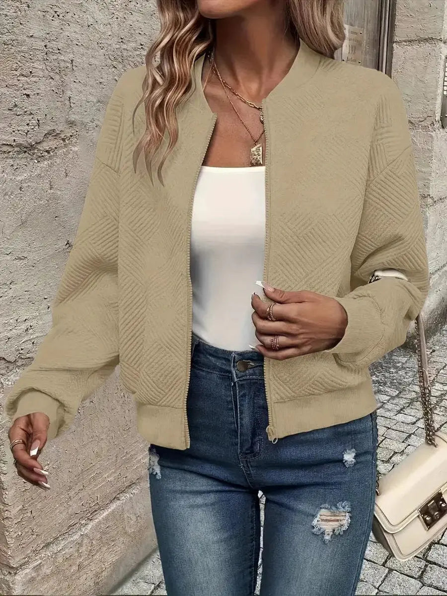 Women's fashionable cropped quilted bomber jacket, textured. Zip-up casual outerwear, great for autumn & winter style.