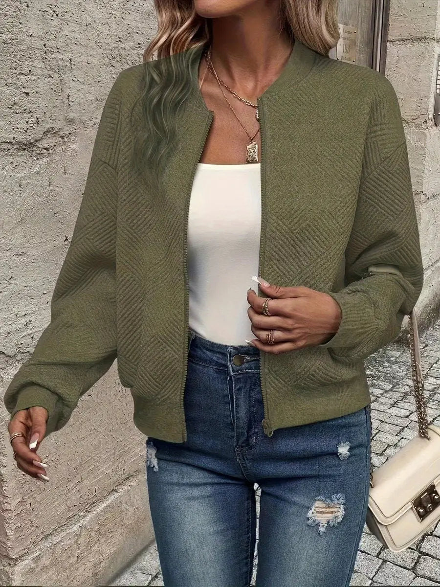 Stylish textured quilted jacket for women, cropped bomber style. An essential zip-up layering piece for autumn fashion.