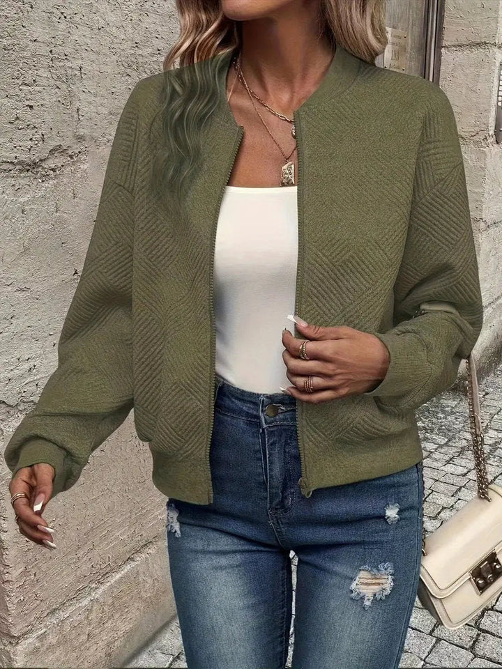 Stylish textured quilted jacket for women, cropped bomber style. An essential zip-up layering piece for autumn fashion.