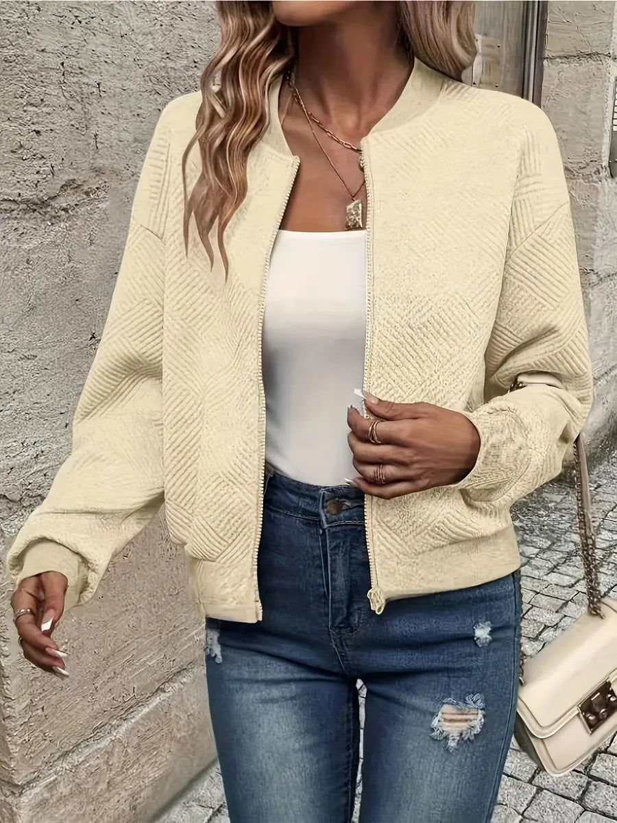 Autumn fashion: Women's cropped quilted bomber jacket, zip-up & textured. Perfect casual outerwear for everyday style.