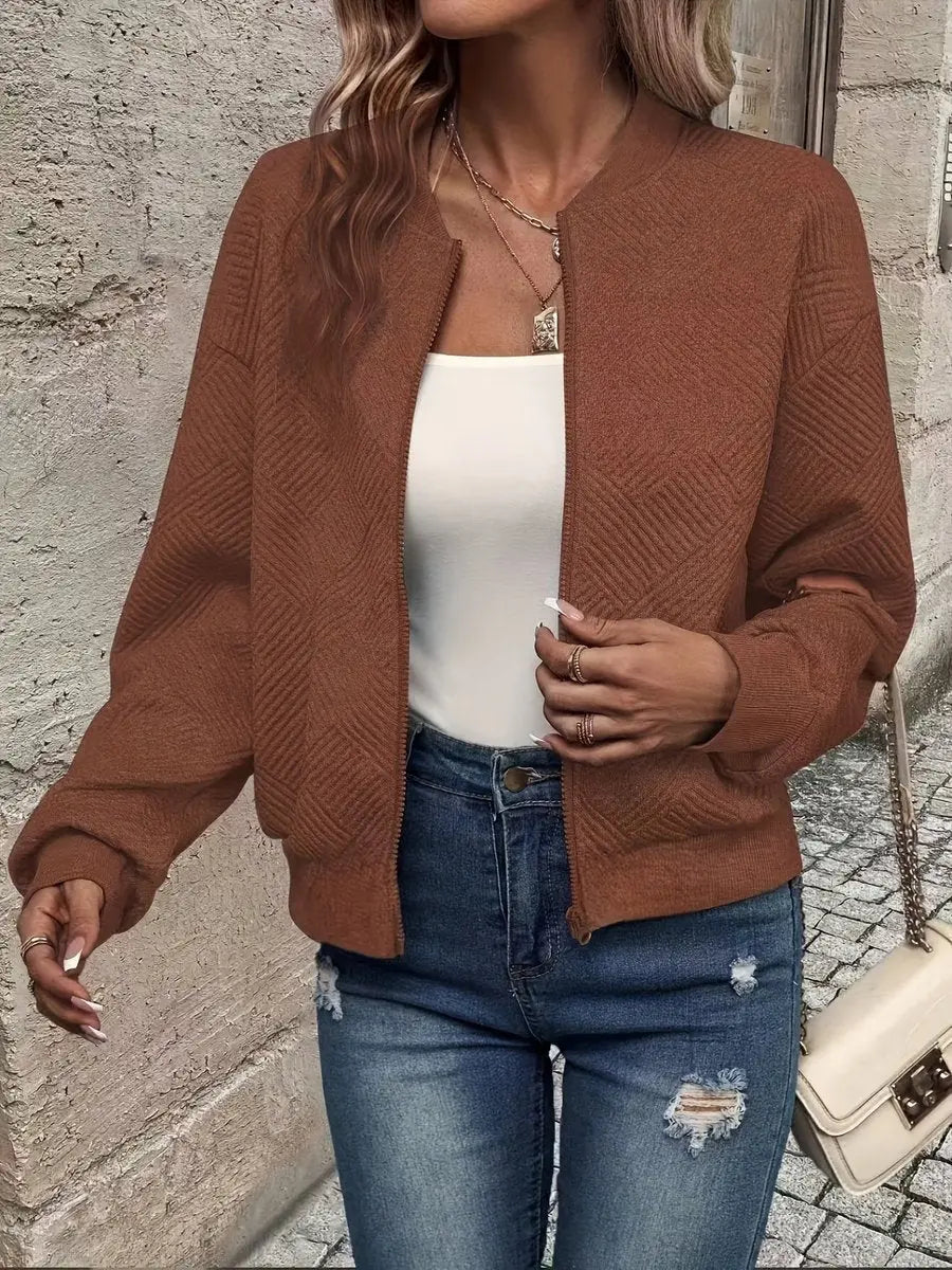 Versatile women's textured quilted bomber jacket, cropped. A chic zip-up layering piece for casual autumn & winter looks.