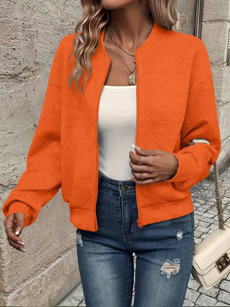 Front view: Women's cropped quilted bomber jacket, zip-up. Textured fabric detailing, perfect casual outerwear for autumn.