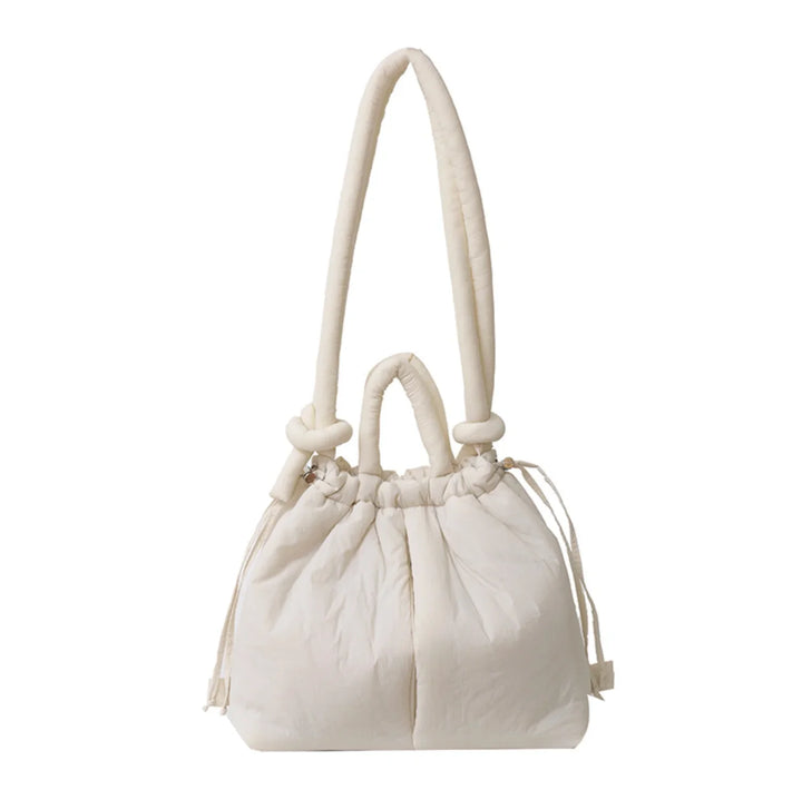 Trend-setting women's puffer bag. Quilted design and an eye-catching knot shoulder strap.