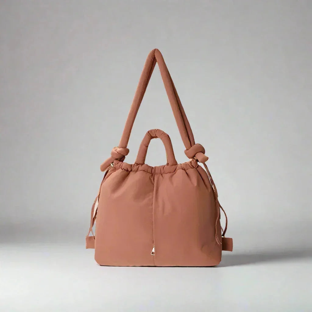 Versatile women's quilted puffer shoulder bag, perfect for daily essentials with knot strap.