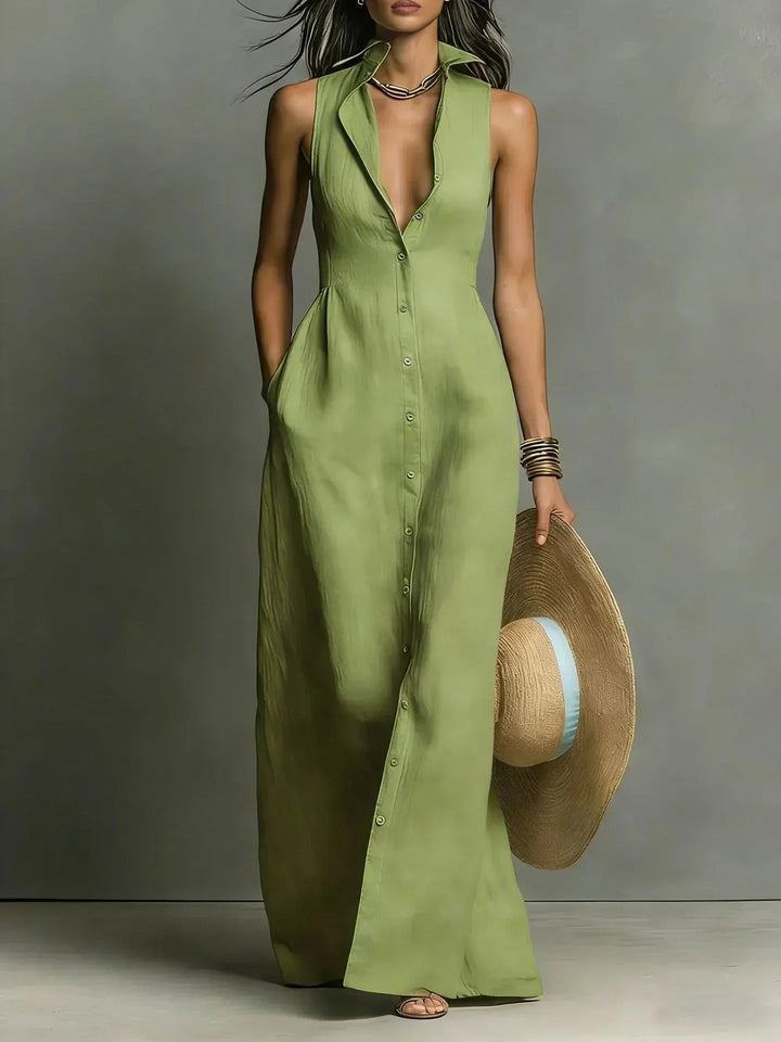 Modest fashion women's sleeveless maxi dress with a collared v-neck, button-down front, and pockets.