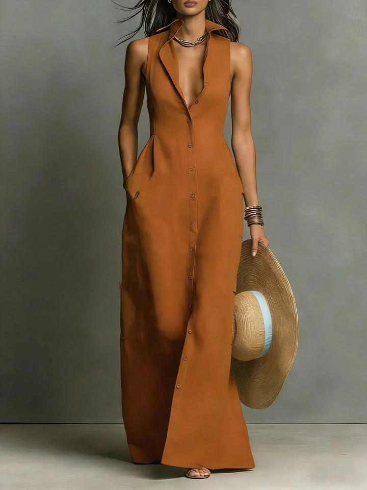 Chic sleeveless collared maxi dress for women. Button-down front, v-neck, and functional side pockets.