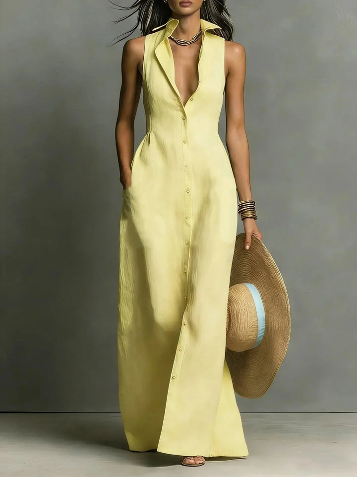 Elegant women's sleeveless collared maxi dress. Button-down front, v-neck, and practical pockets.