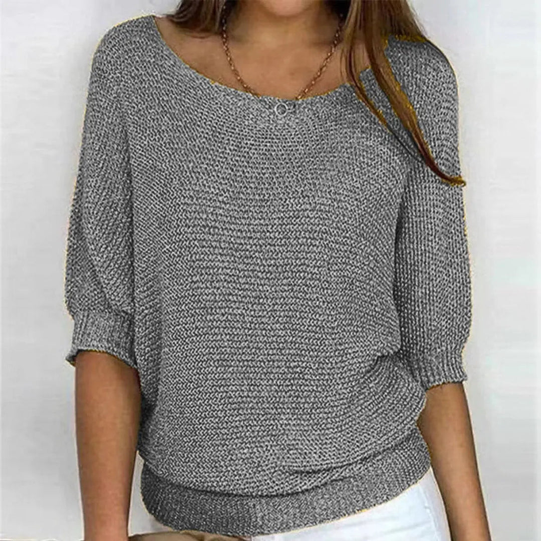 Stylish women's batwing-sleeve sweater with a relaxed fit and scoop neck, ideal for versatile autumn fashion.