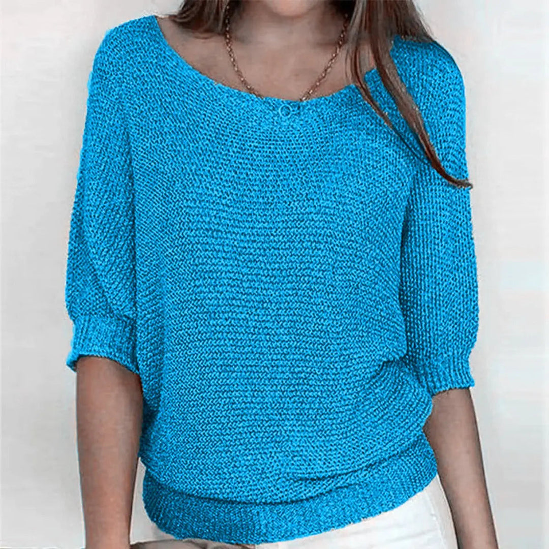 Comfortable women's relaxed-fit sweater featuring elegant batwing sleeves, great for chic casual style.