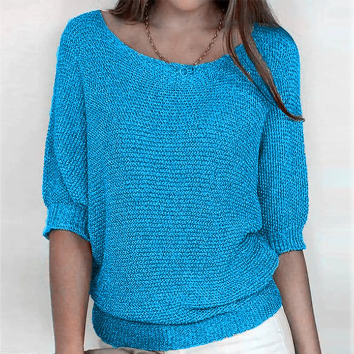 Comfortable women's relaxed-fit sweater featuring elegant batwing sleeves, great for chic casual style.