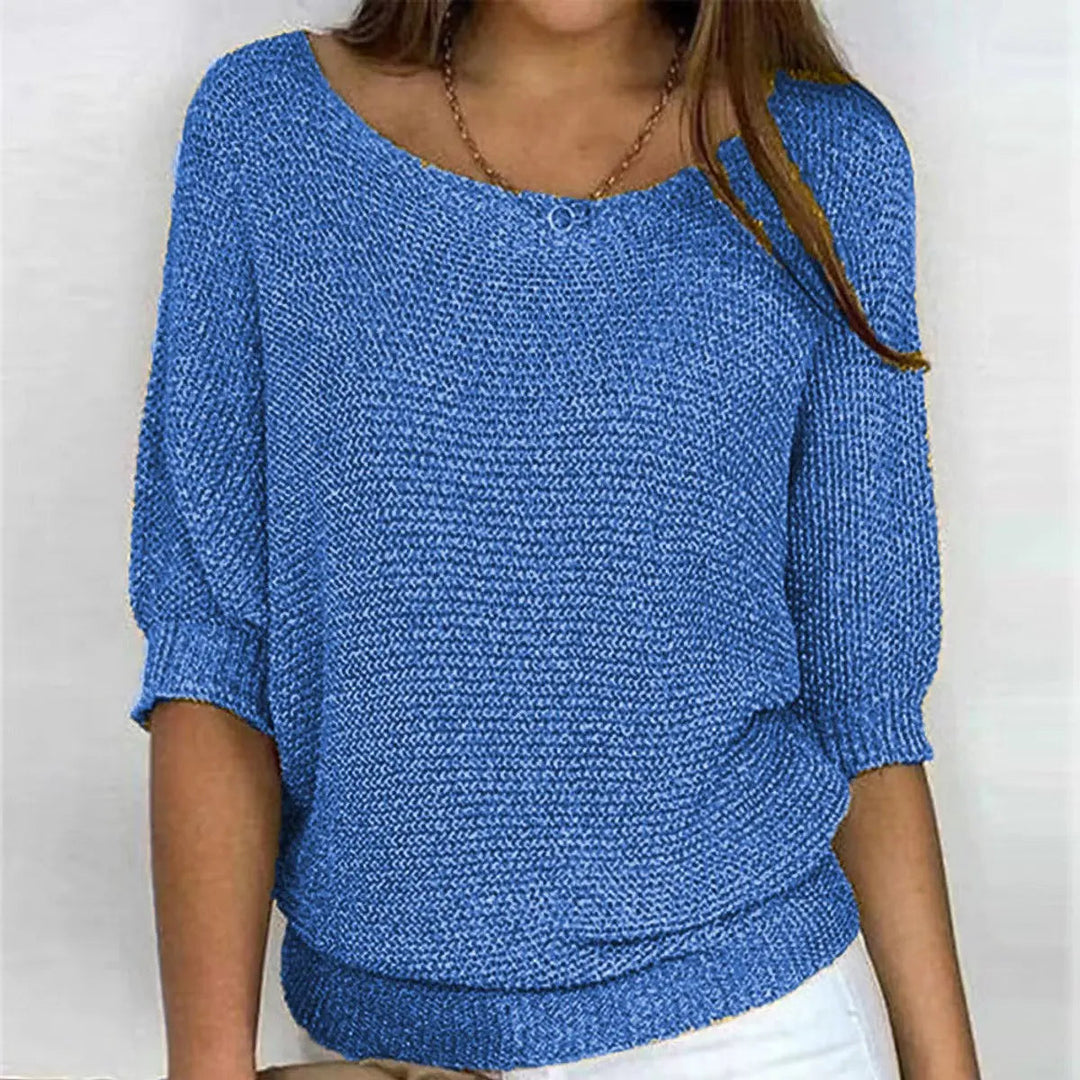 Versatile women's scoop-neck batwing sweater, a relaxed-fit top for everyday wear and comfortable style.