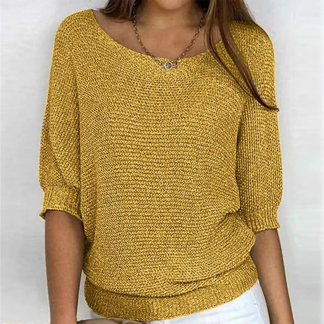 Relaxed-fit women's sweater, a chic batwing-sleeve top offering comfortable style for any casual occasion.