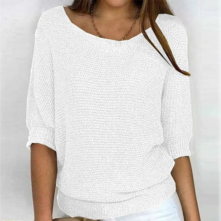 Stylish women's autumn sweater with a relaxed fit and dramatic batwing sleeves, perfect for casual chic.