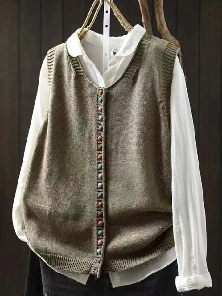 Fashionable women's sleeveless knitted vest with a relaxed fit, soft knit for casual autumn style.
