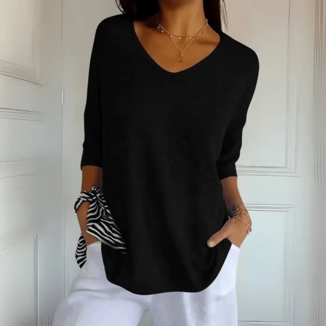 Everyday women's V-neck top with 3/4 sleeves & relaxed fit. Perfect casual spring/summer wear.