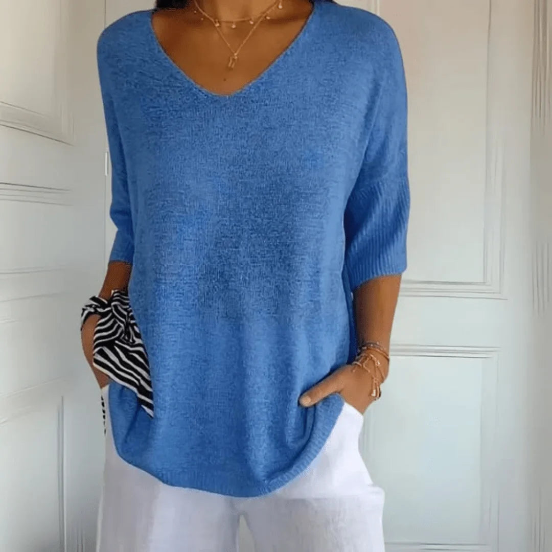 Stylish women's spring/summer top: relaxed fit, V-neck, 3/4 sleeves. Perfect for comfortable fashion.