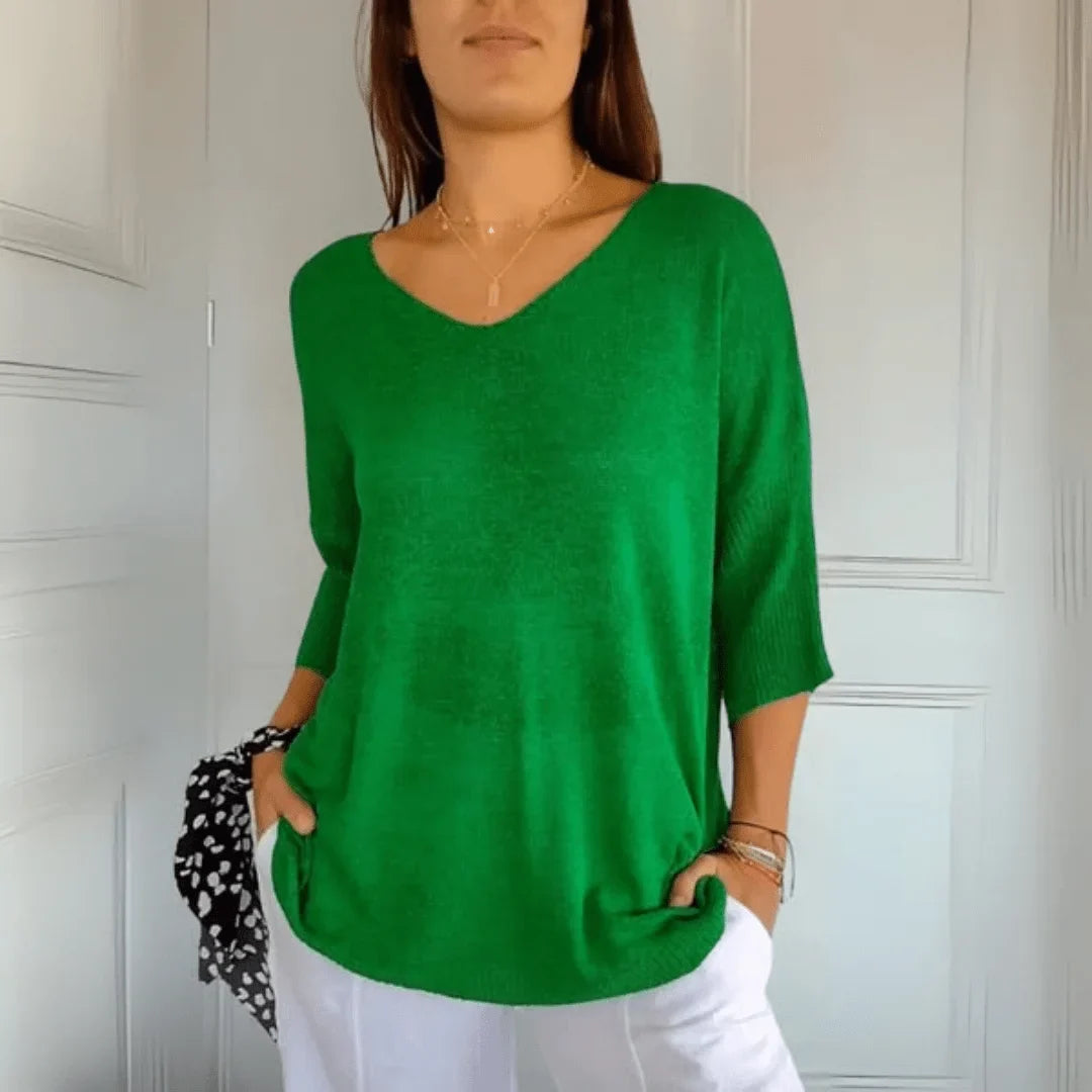 Women's casual V-neck top with 3/4 sleeves. Relaxed fit for effortless style & everyday comfort.