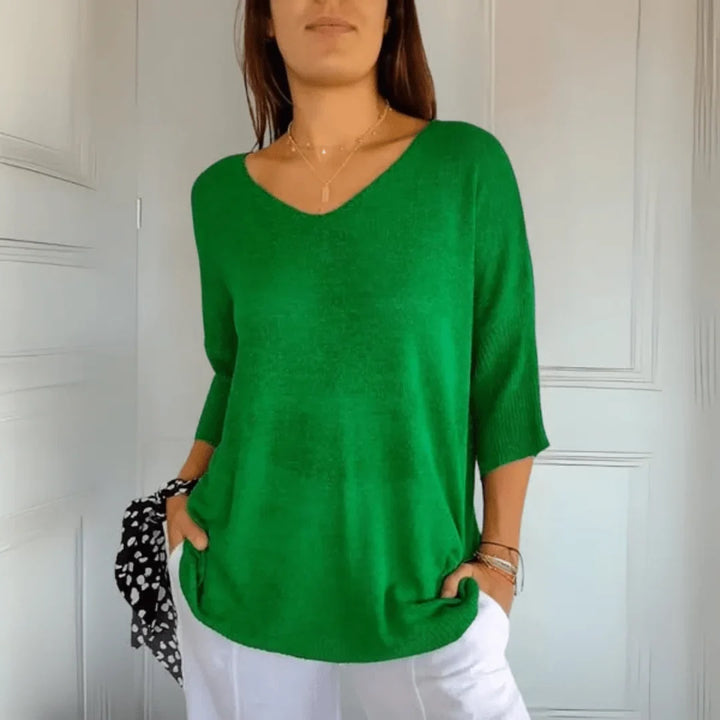 Women's casual V-neck top with 3/4 sleeves. Relaxed fit for effortless style & everyday comfort.