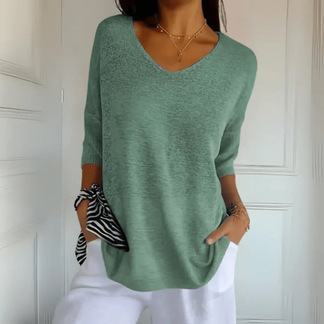 Comfortable women's casual top, featuring a V-neck & 3/4 sleeves. Versatile for everyday wear.
