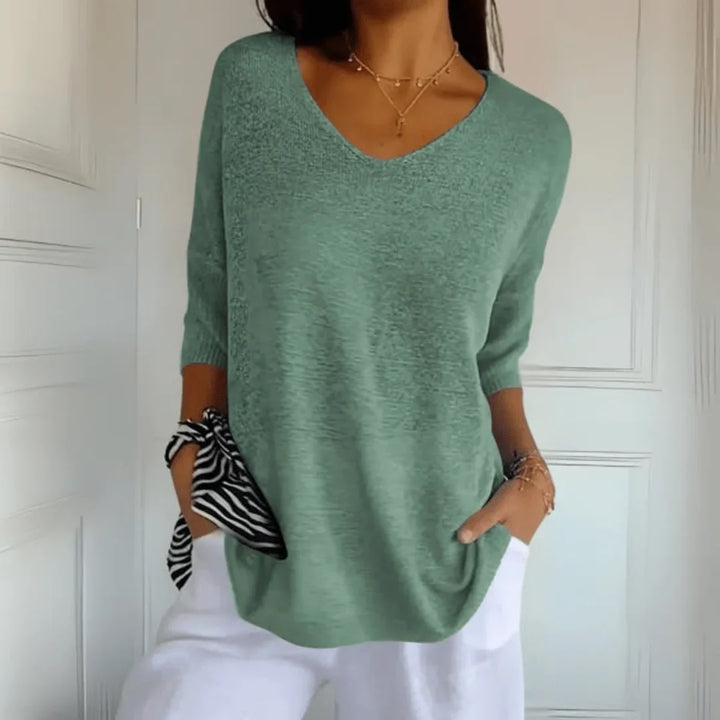 Comfortable women's casual top, featuring a V-neck & 3/4 sleeves. Versatile for everyday wear.