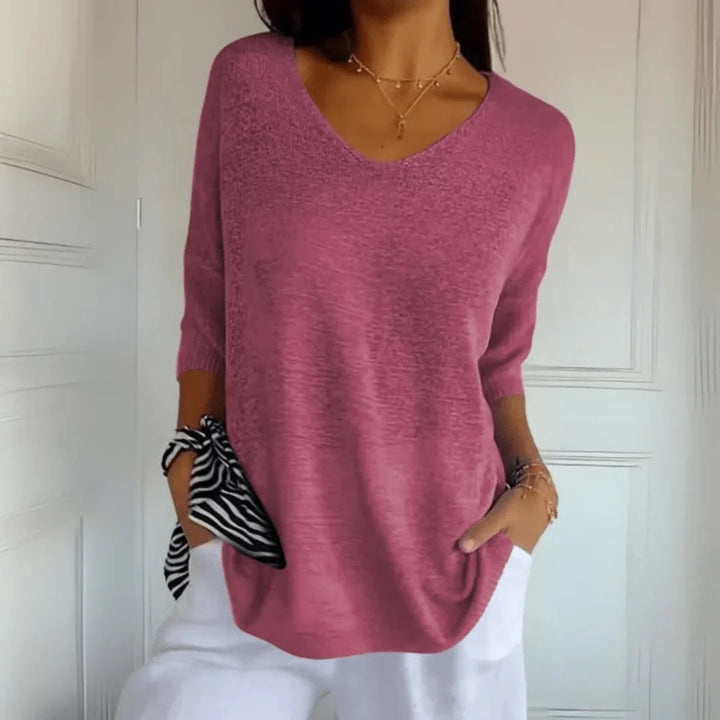 Fashionable women's 3/4-sleeve V-neck top in a relaxed fit for versatile, comfortable styling.