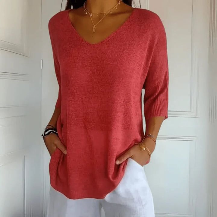 Women's relaxed V-neck 3/4-sleeve top, perfect for casual everyday wear & summer style.