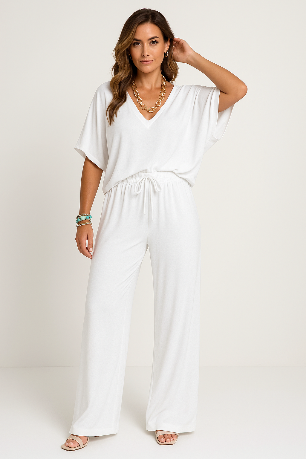 Women's relaxed fit lounge set; cotton blend V-neck top, batwing sleeves, wide-leg pants, ideal for casual wear.