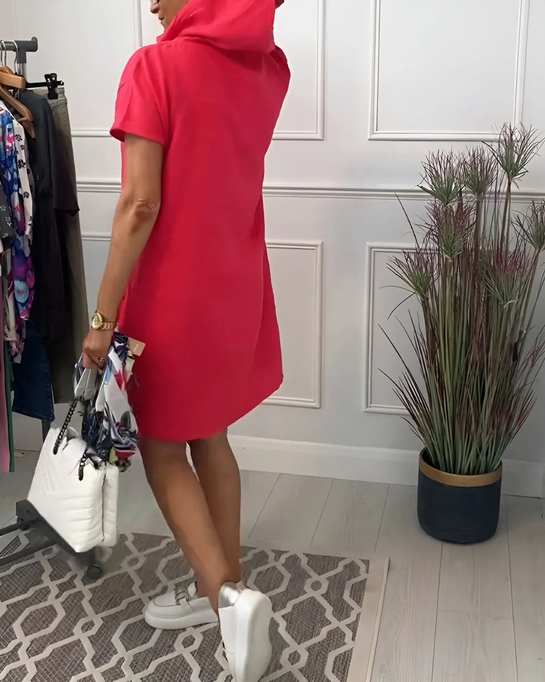 Relaxed fit women's hoodie mini dress, short sleeve, and practical pockets for everyday comfort.
