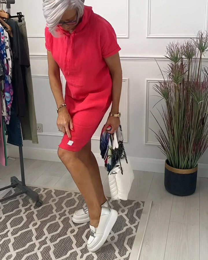 Versatile women's short-sleeve hoodie mini dress with pockets, great for casual everyday fashion.