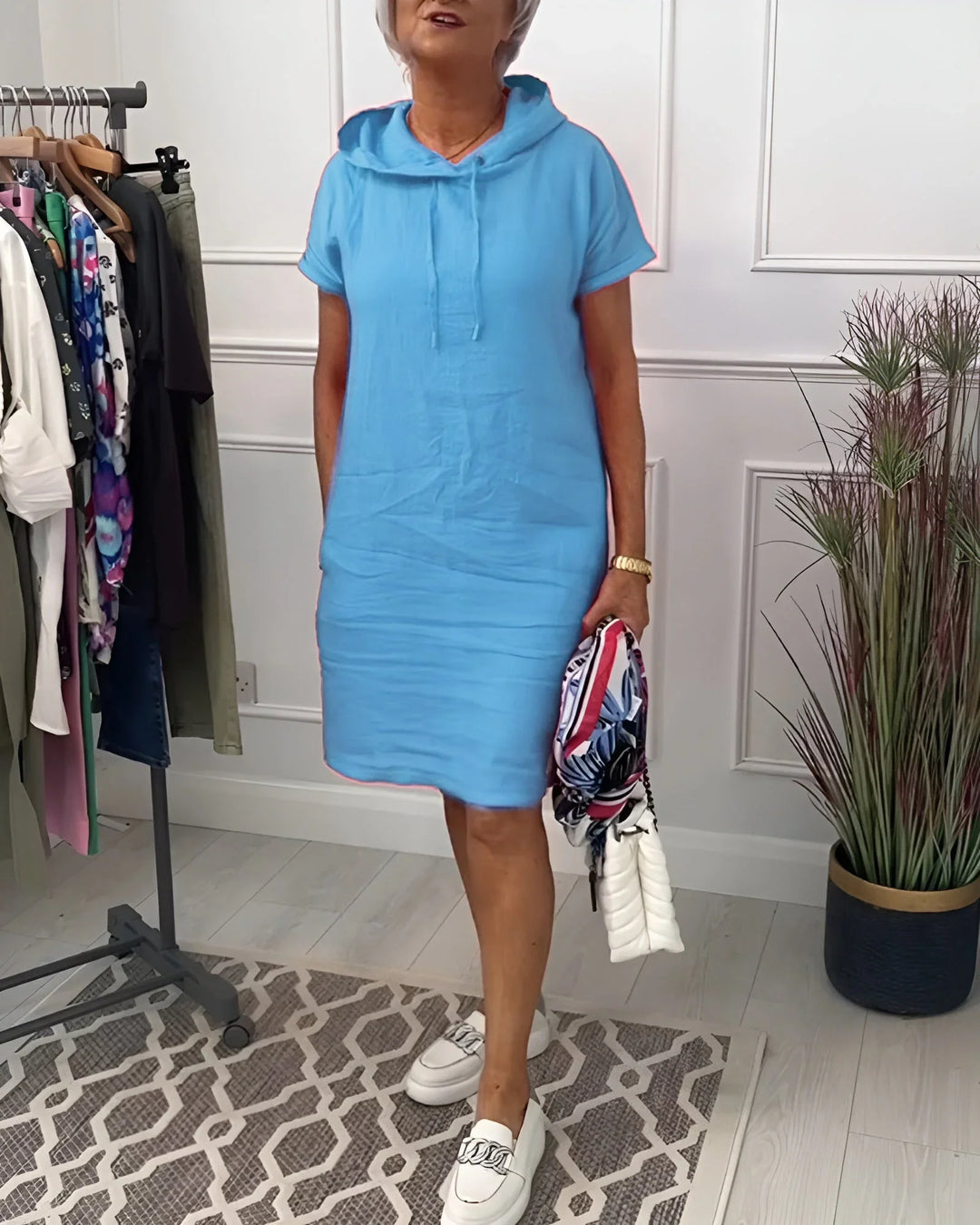 Soft fabric women's short sleeve hoodie mini dress with pockets, designed for ultimate comfort and style.
