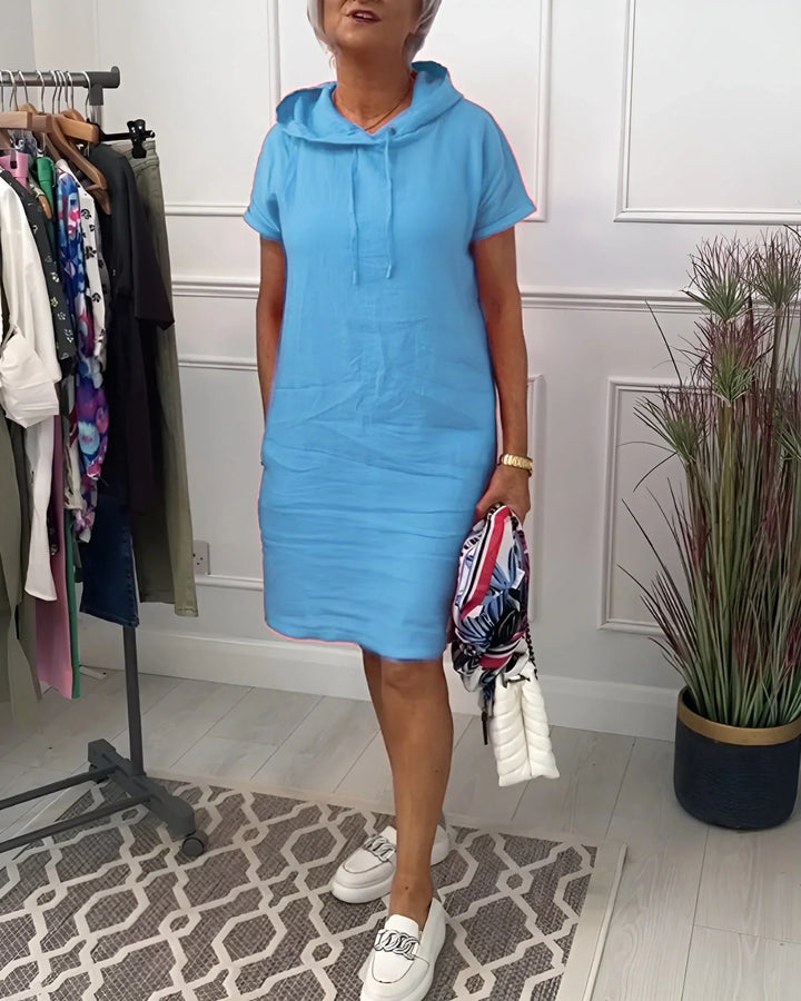 Soft fabric women's short sleeve hoodie mini dress with pockets, designed for ultimate comfort and style.