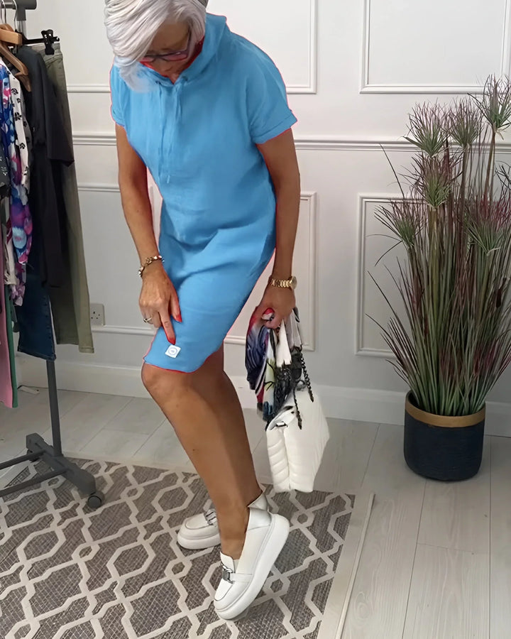 Back view of a women's cozy short sleeve hoodie mini dress with a comfortable fit.