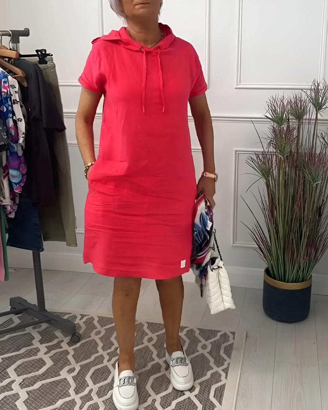 Women's cozy short sleeve hoodie mini dress with pockets, perfect for casual summer wear.