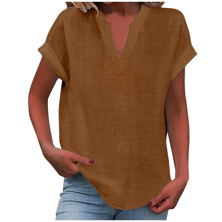 Women's relaxed fit V-neck blouse with cuffed sleeves, a must-have for spring and summer.