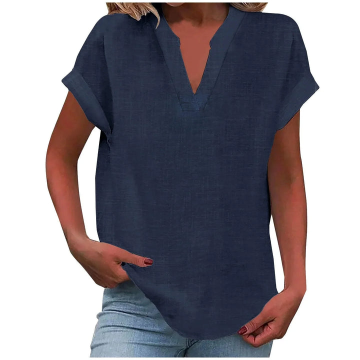 Women's smart casual V-neck blouse with cuffed sleeves, styled for a polished yet comfortable look.