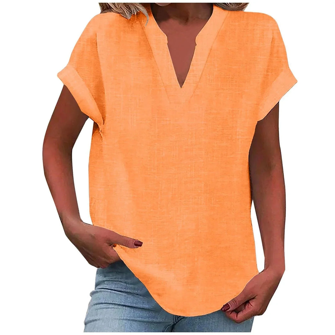 Effortless women's V-neck blouse with stylish cuffed sleeves, perfect for a chic, relaxed outfit.