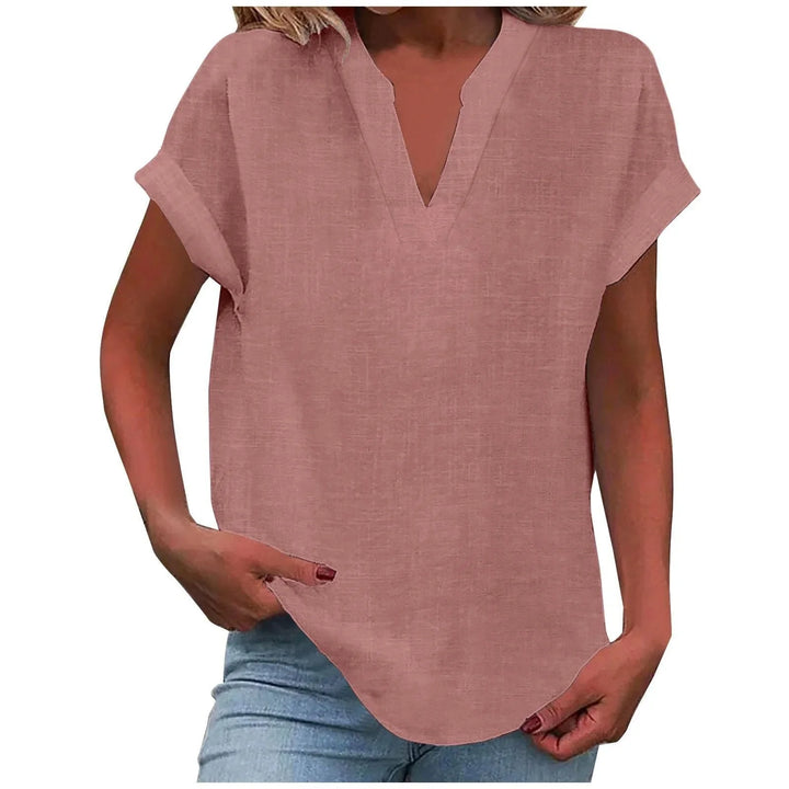 Stylish women's V-neck blouse, perfect for spring/summer, featuring elegant cuffed sleeves.