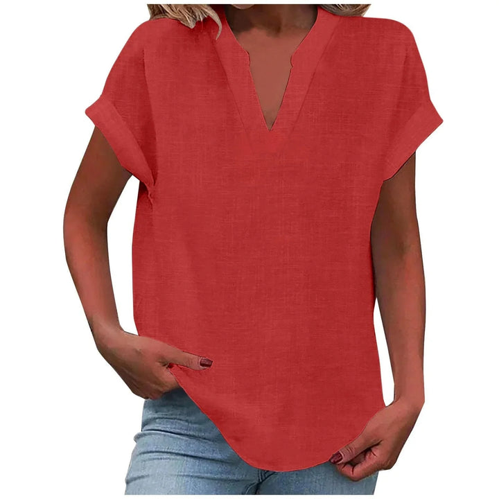 Casual chic women's V-neck top with a relaxed fit & cuffed sleeves, ideal for everyday elegance.