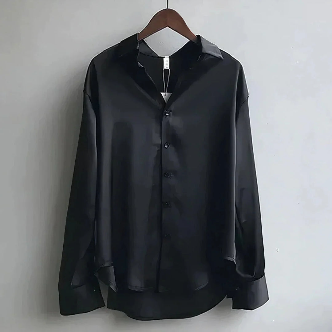 Formal women's long-sleeve button-down blouse with classic collar, ideal for professional workwear.