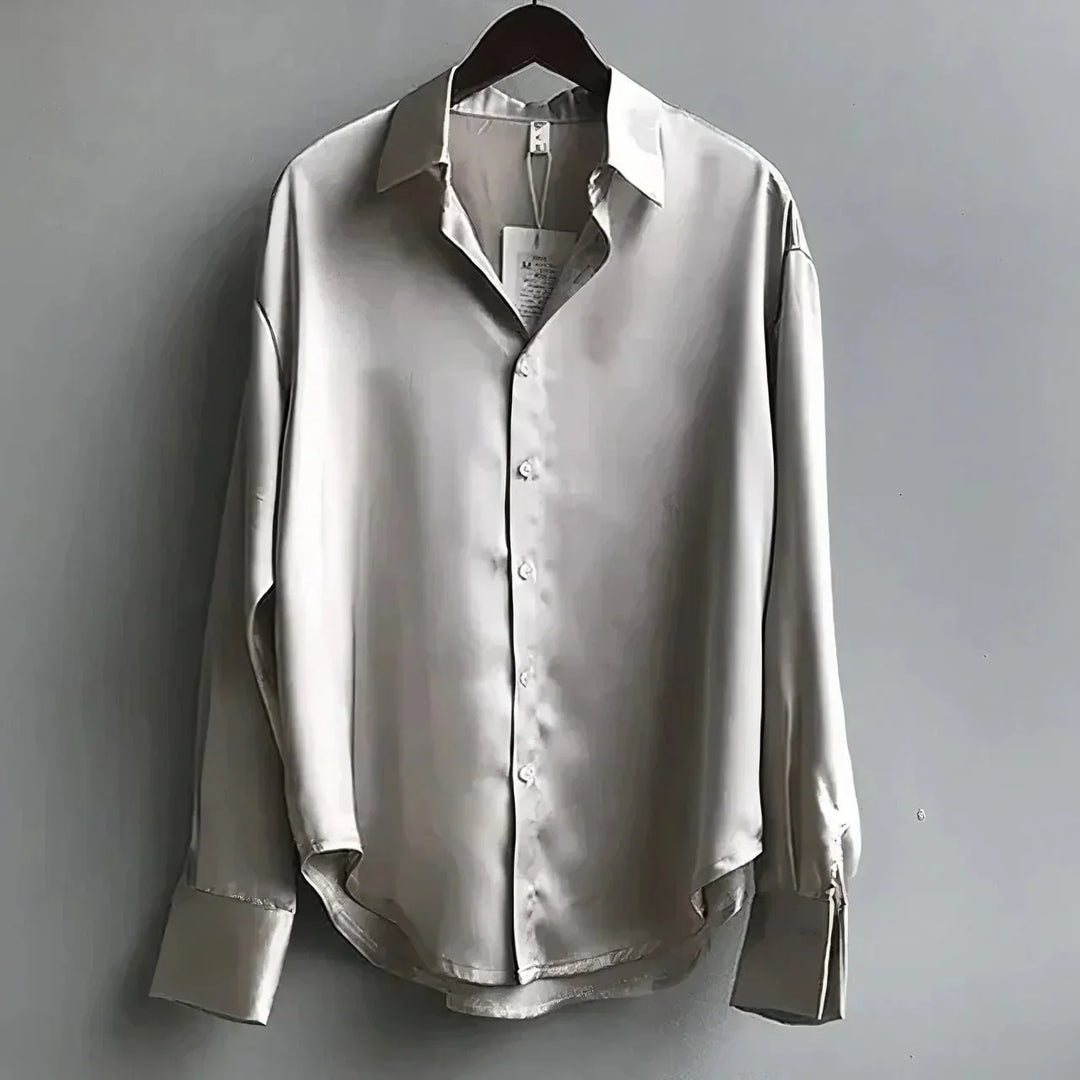 Stylish women's long-sleeve button-down collared top, a comfortable and elegant choice for any outfit.