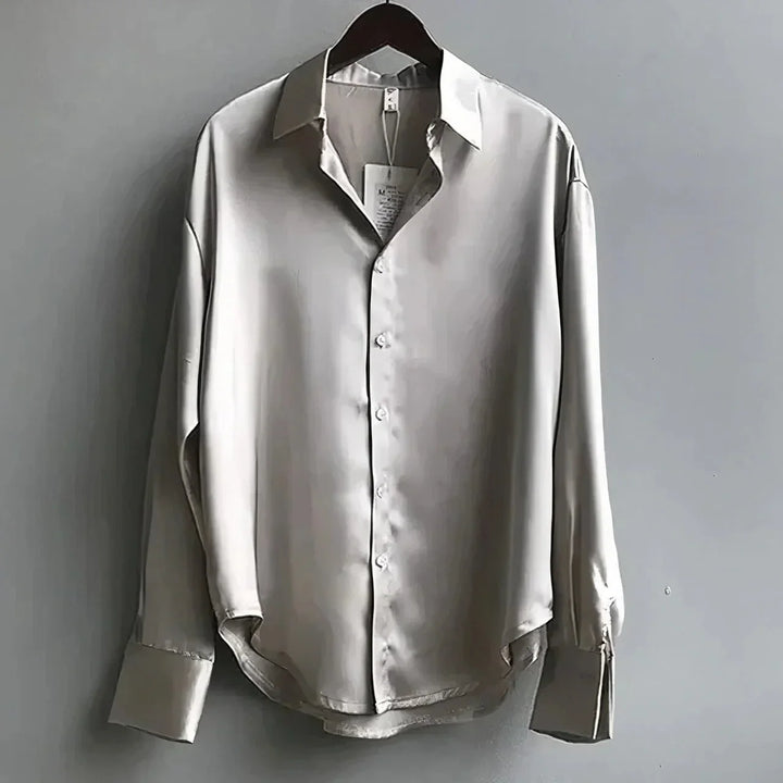 Stylish women's long-sleeve button-down collared top, a comfortable and elegant choice for any outfit.