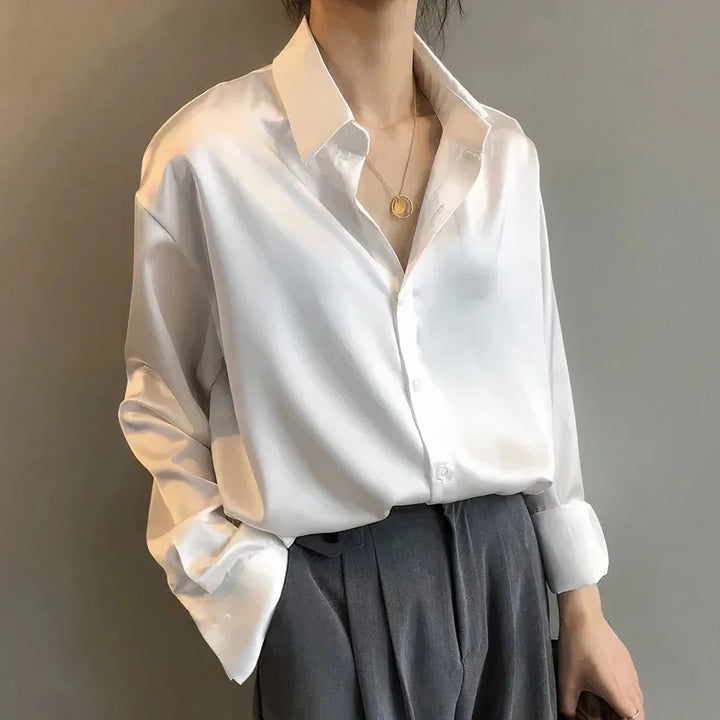 Versatile women's long-sleeve button-down blouse, collared & chic for smart casual or everyday luxury.