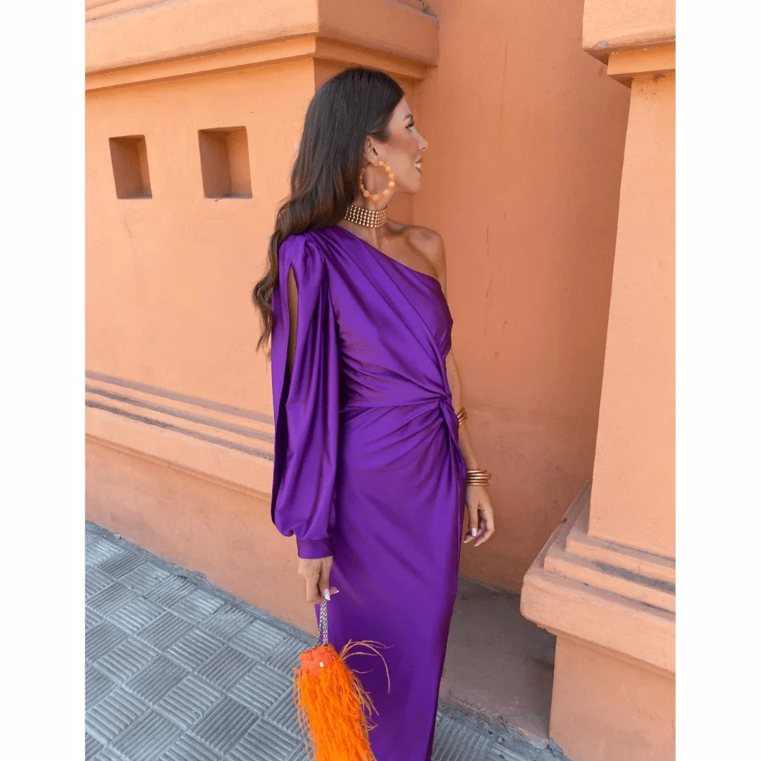 Flattering women's evening wear: a one-shoulder long-sleeve maxi dress with a twisted front and graceful leg slit.