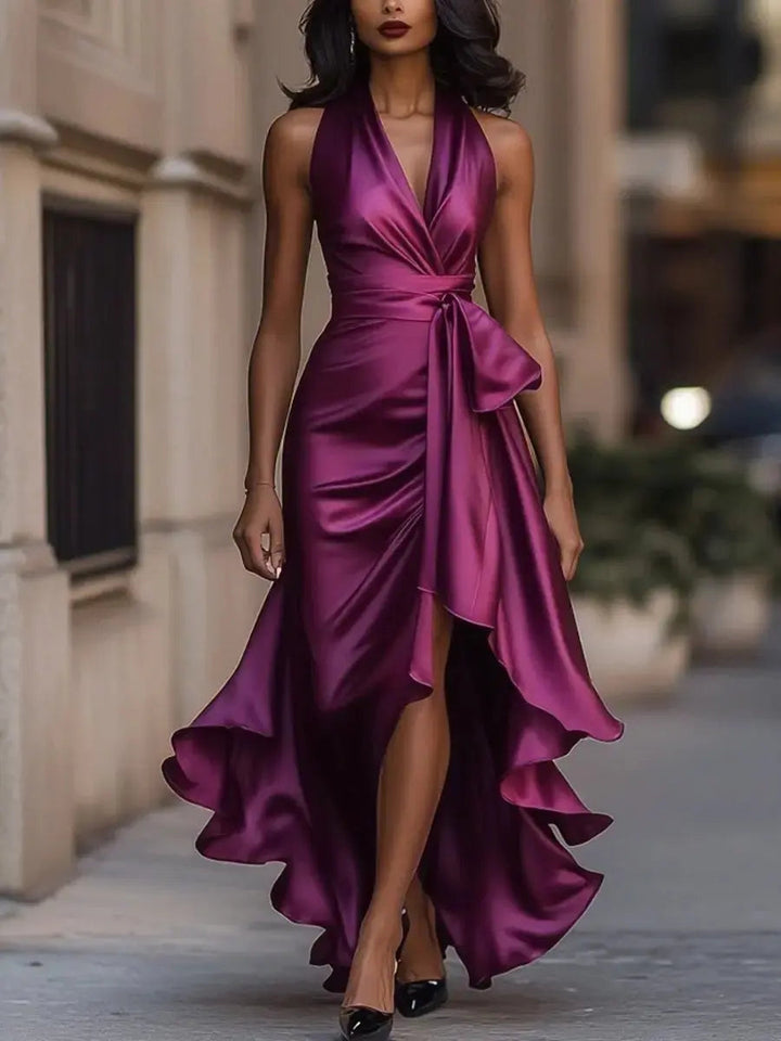 Elegant women's fashion: halter high-low evening gown with a flattering bow waist, perfect for formal events.