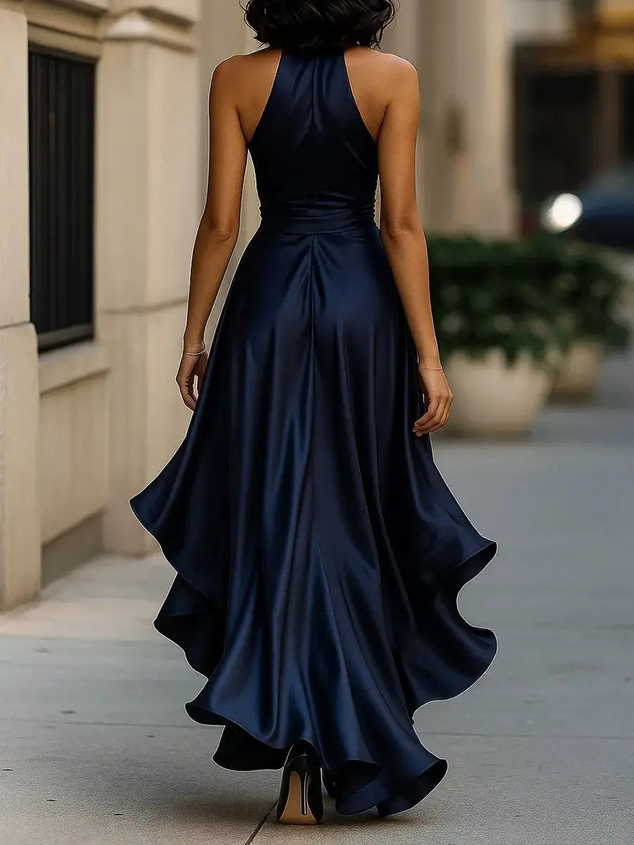 Satin high-low party dress for women, boasting a flattering halter design and a prominent bow detail at the waist.