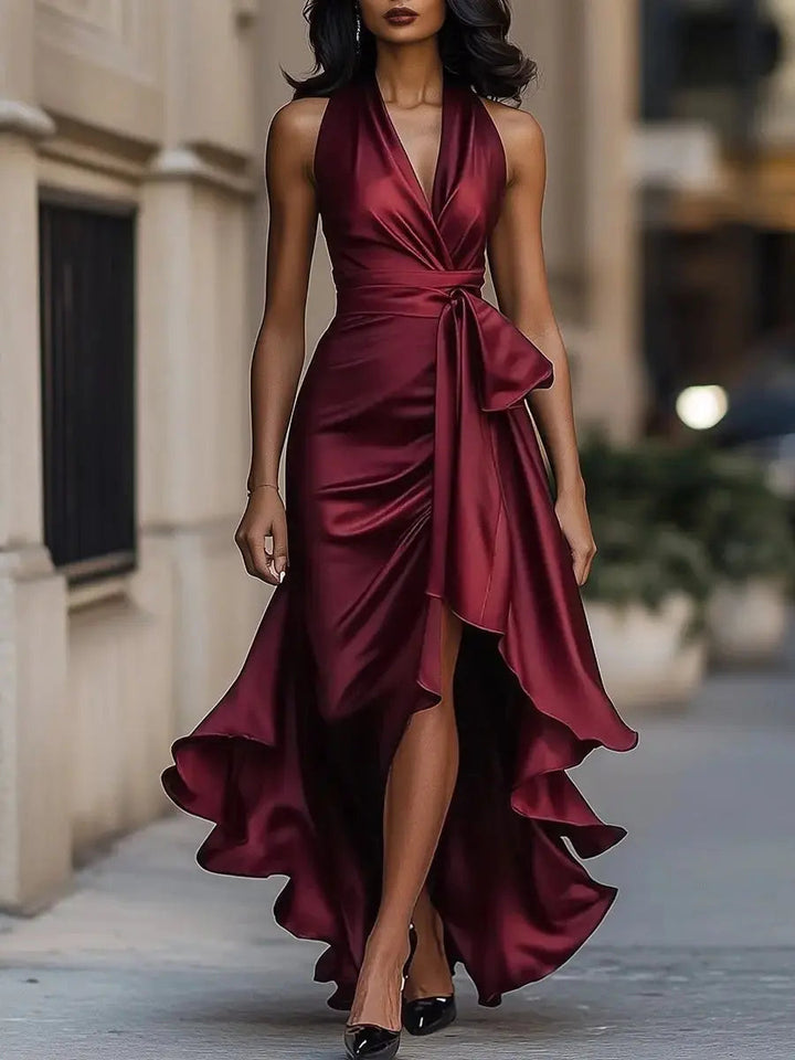 Beautiful women's occasion wear: halter high-low dress in satin with a statement bow waist, very elegant.